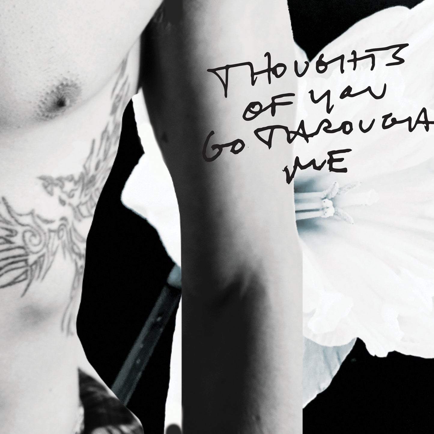 Black and white close-up of a person's arm with text 'Thoughts of you go through me' written on it.
