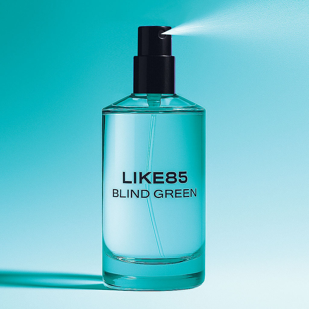 Clear bottle labeled 'LIKE85 BLIND GREEN' with a black pump on a teal background