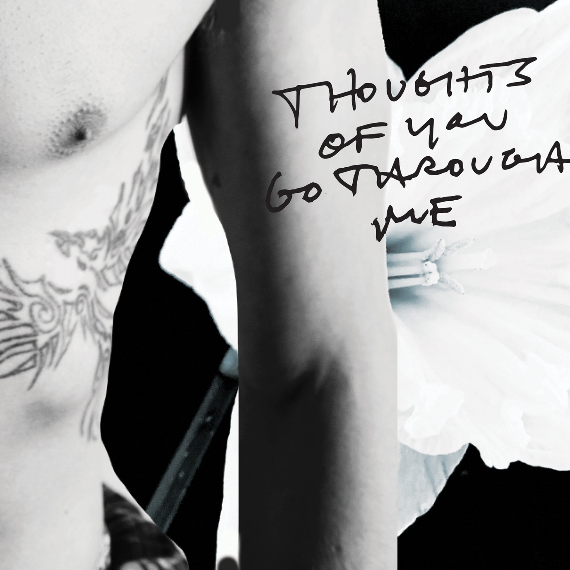 Black and white close-up of a person's arm with text 'Thoughts of you go through me' written on it.